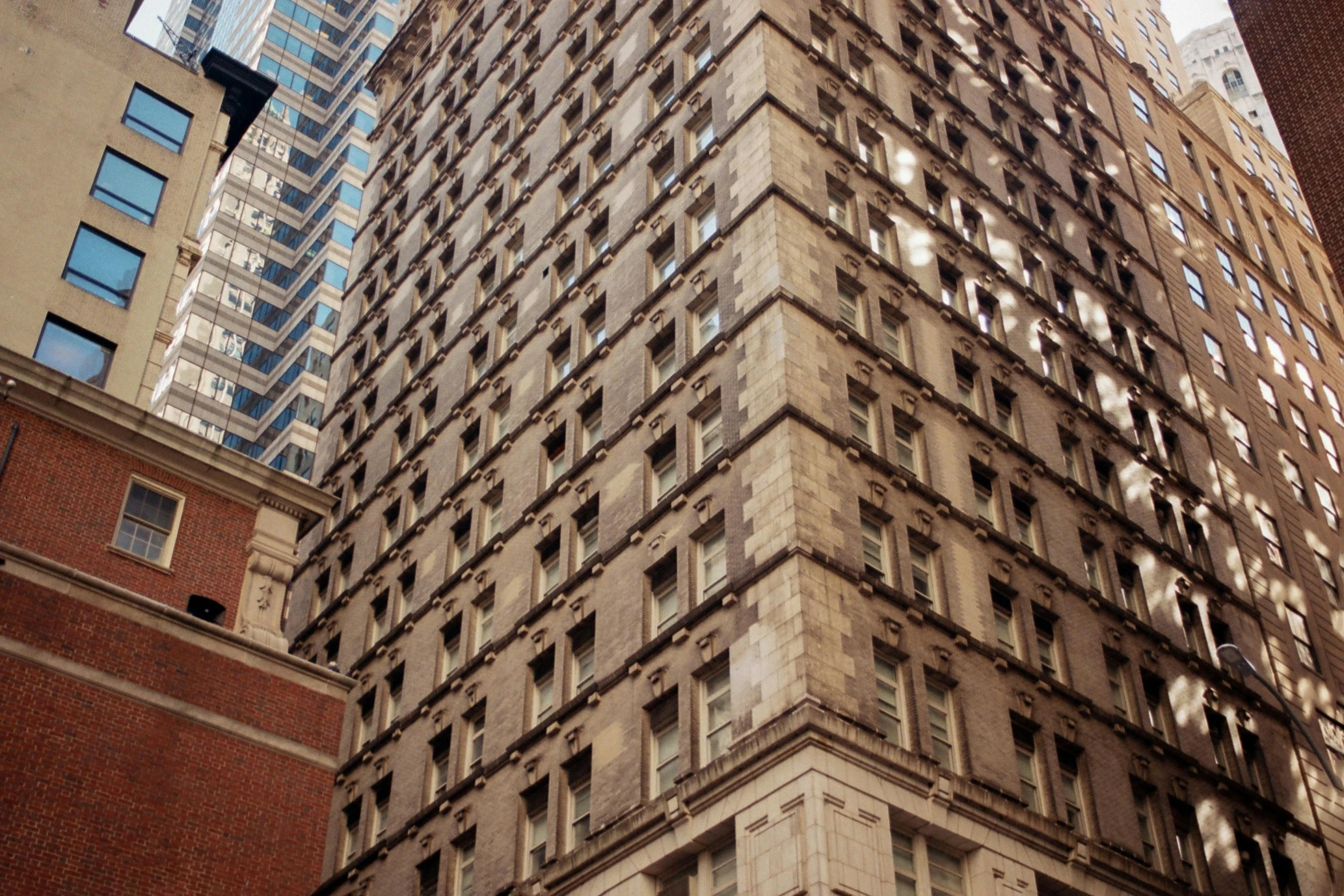 this is a very tall building on the corner of the street