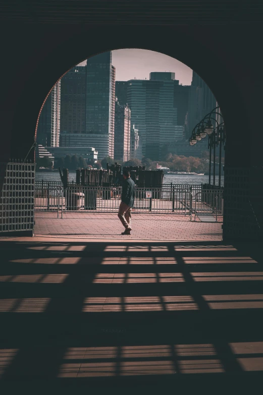 a man that is running through some kind of tunnel