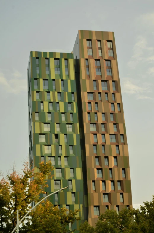 a big building with some multicolored buildings near by