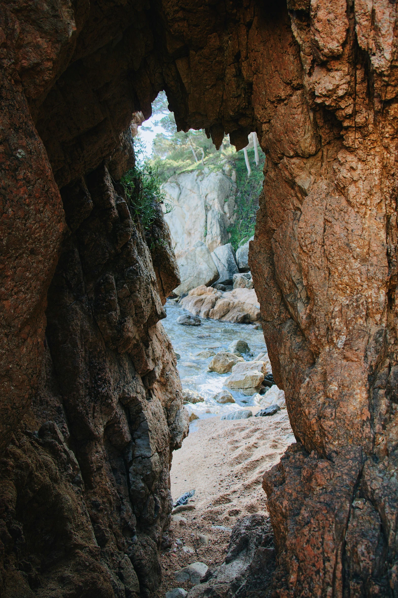 a man stands inside of an outdoor area while walking along a river