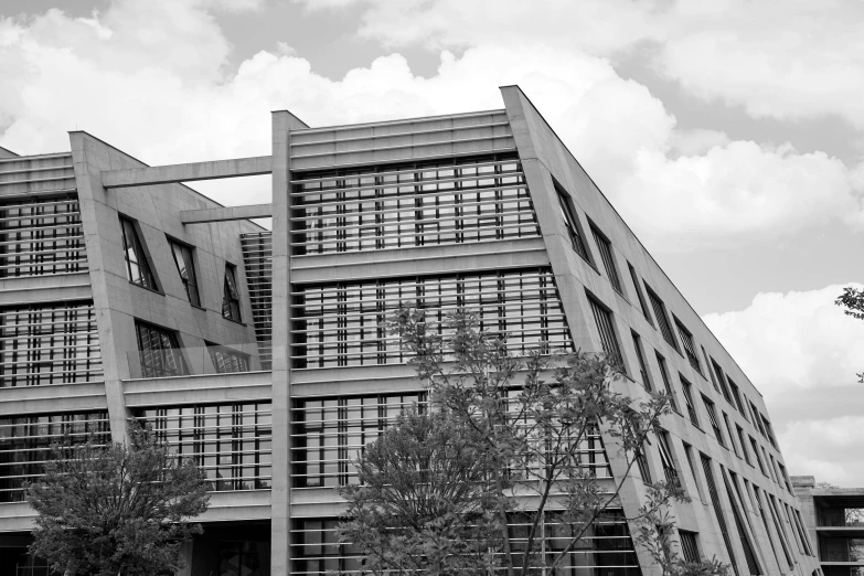 black and white image of a building that is made out of metal pipes