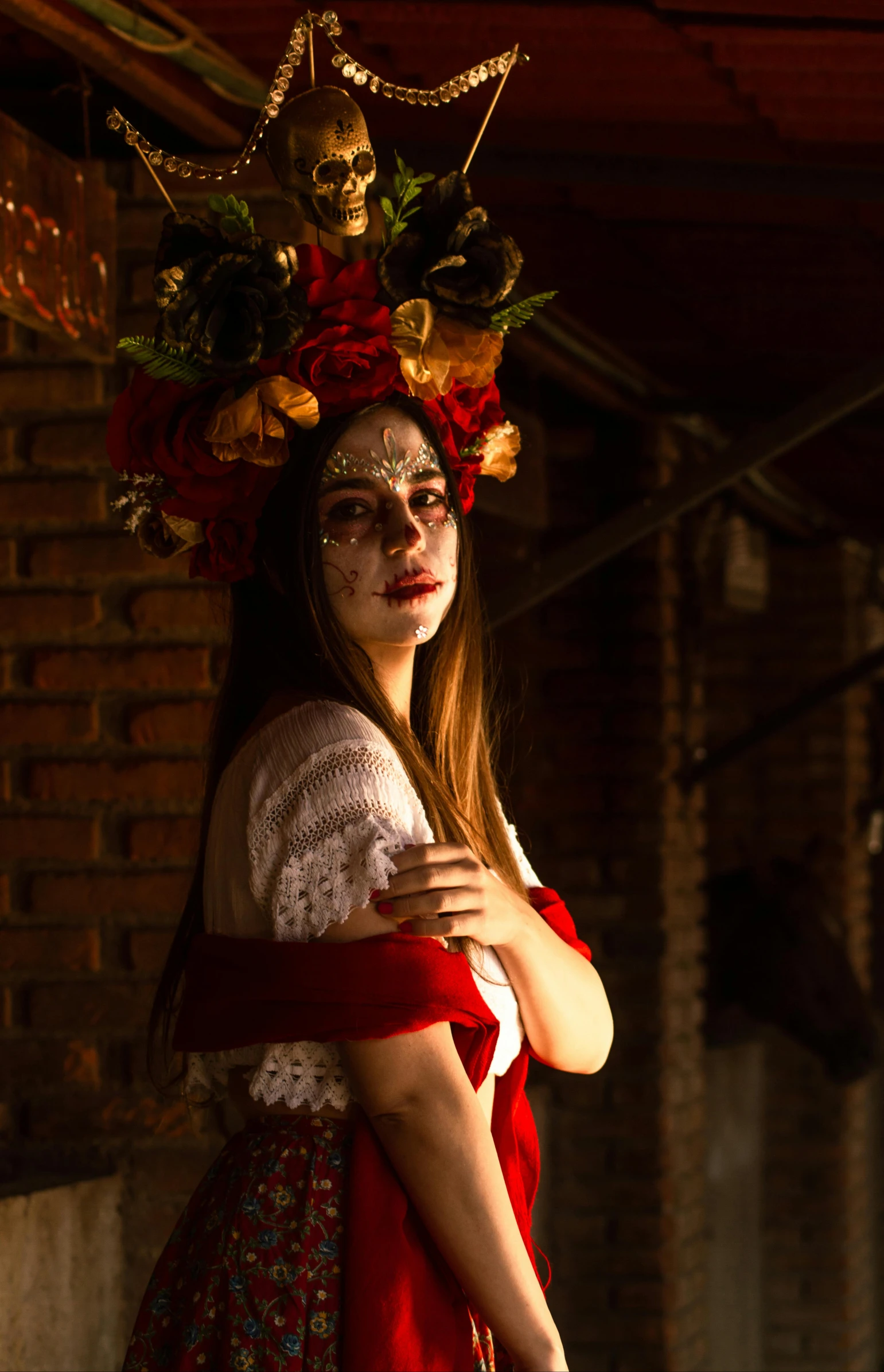 a woman with makeup on her face and in the background a brick wall