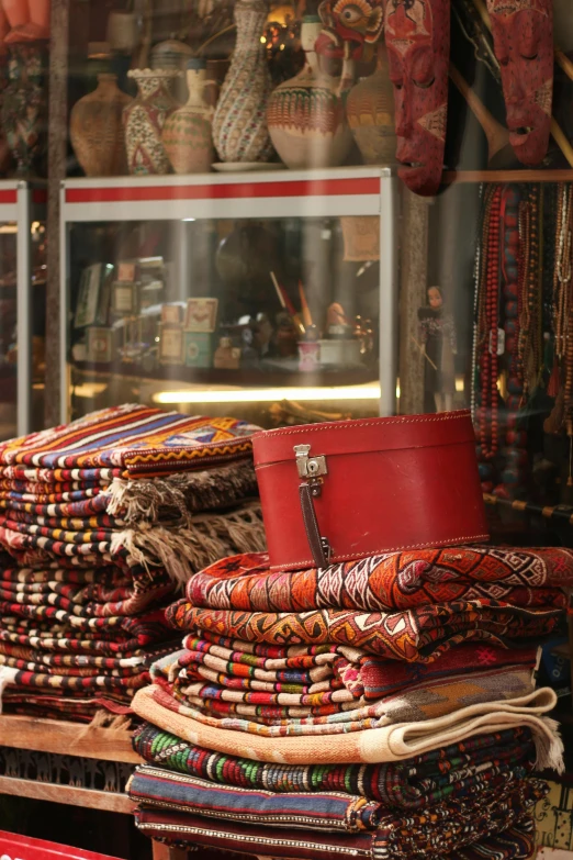 several baskets and bags stacked on a table