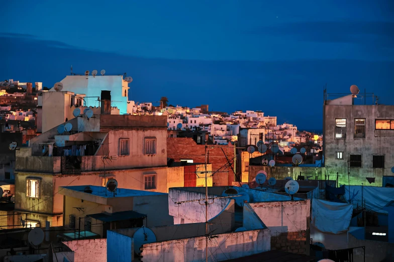 a night view of the skyline with buildings and colorful lights