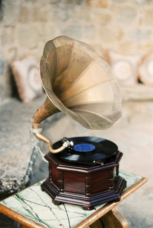 there is a musical record sitting on top of an old record player