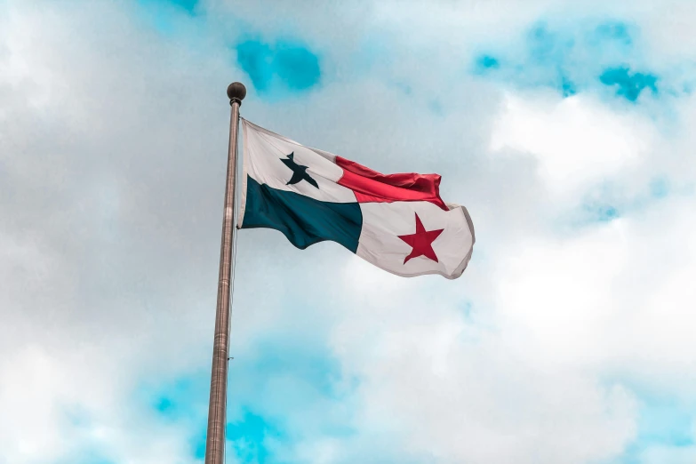 an american and texas flag are on display