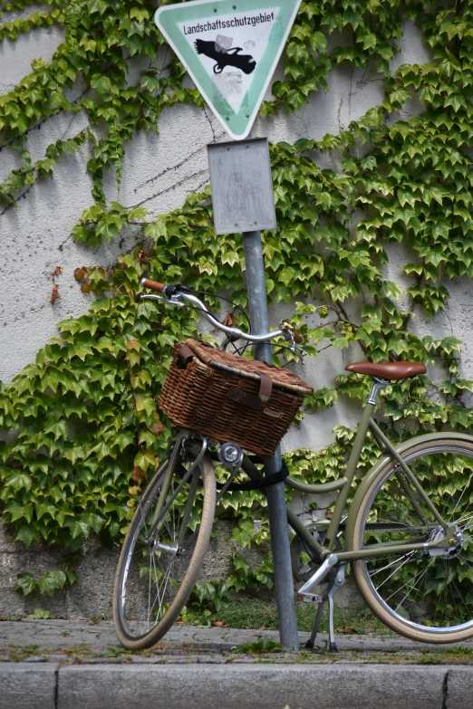 the bike is parked next to the road sign