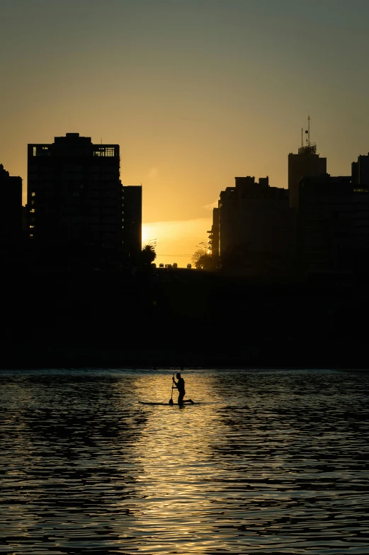 there is a person rowing out in the water