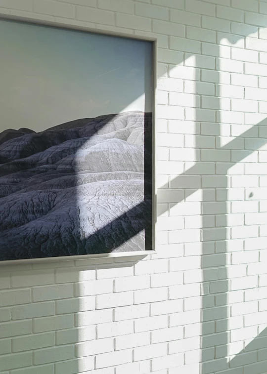 a view of a mountain is seen through a window