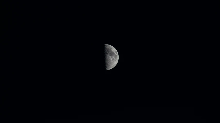 the moon that appears to be over dark sky