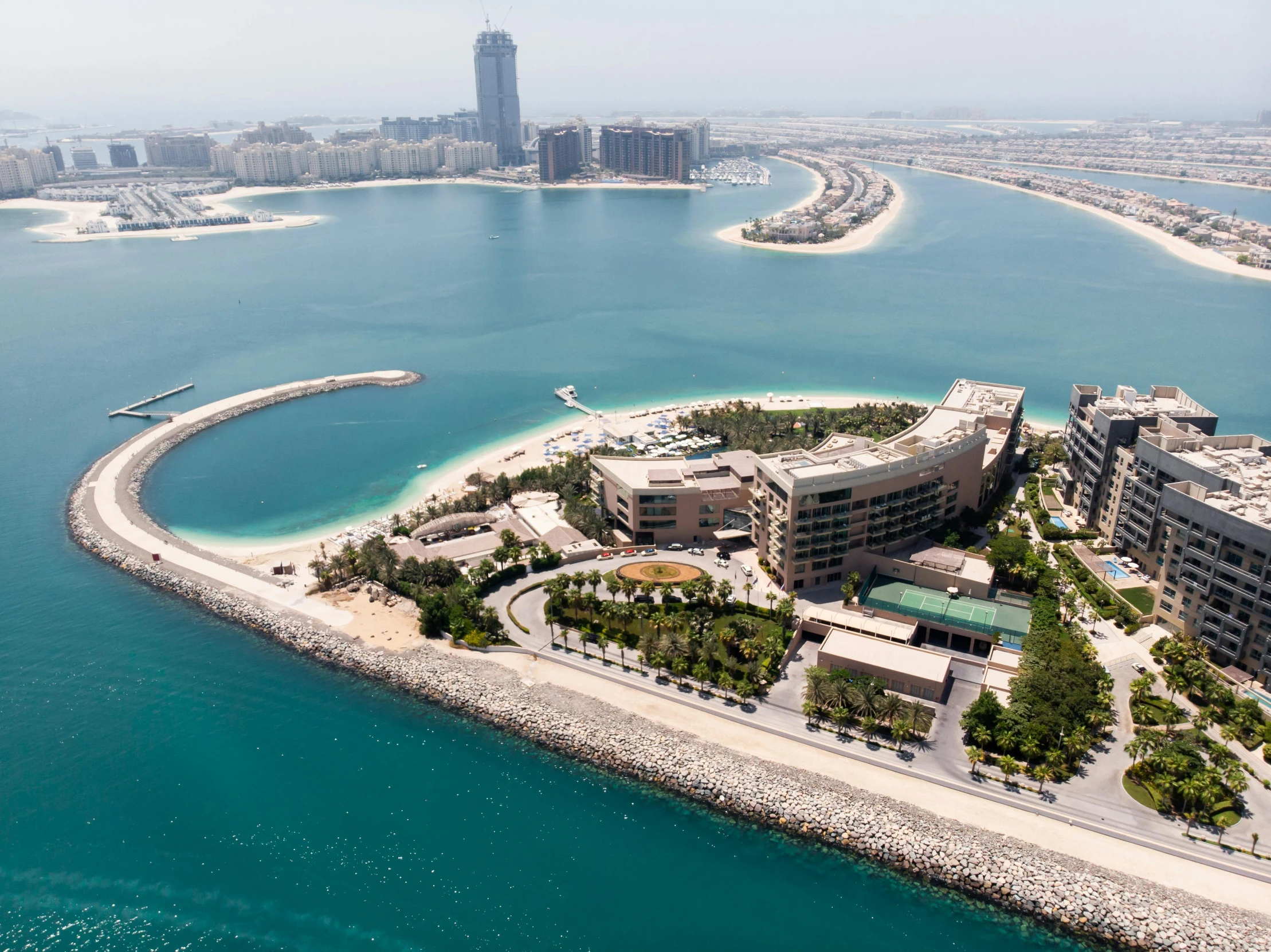 an aerial view of the ocean and a city