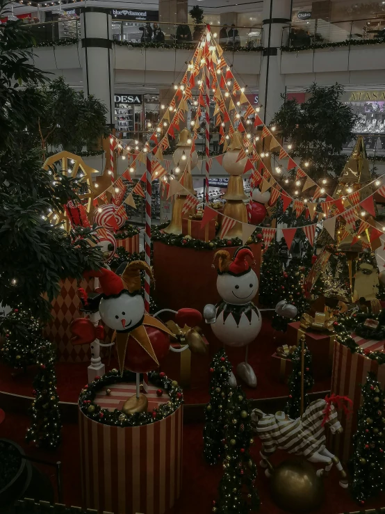 christmas decorations are arranged and placed in a shopping mall