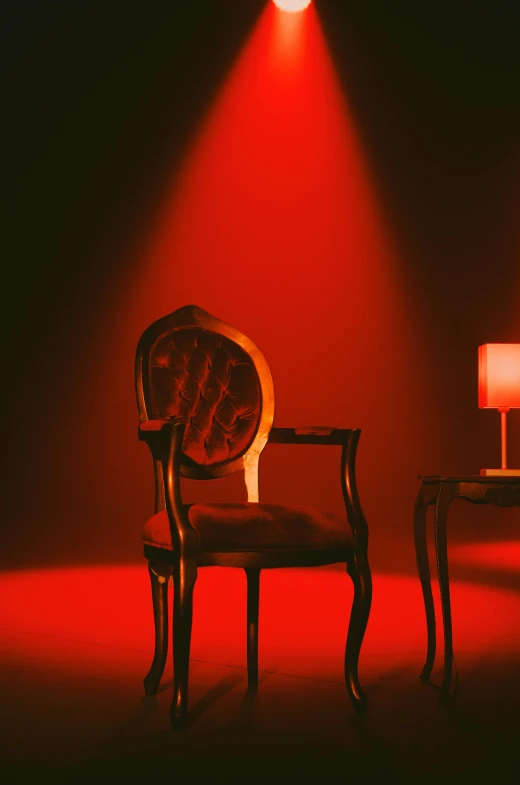 an empty chair sitting on a red floor