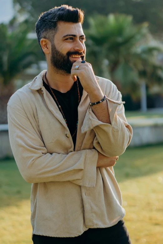 a man standing outside smiling for the camera