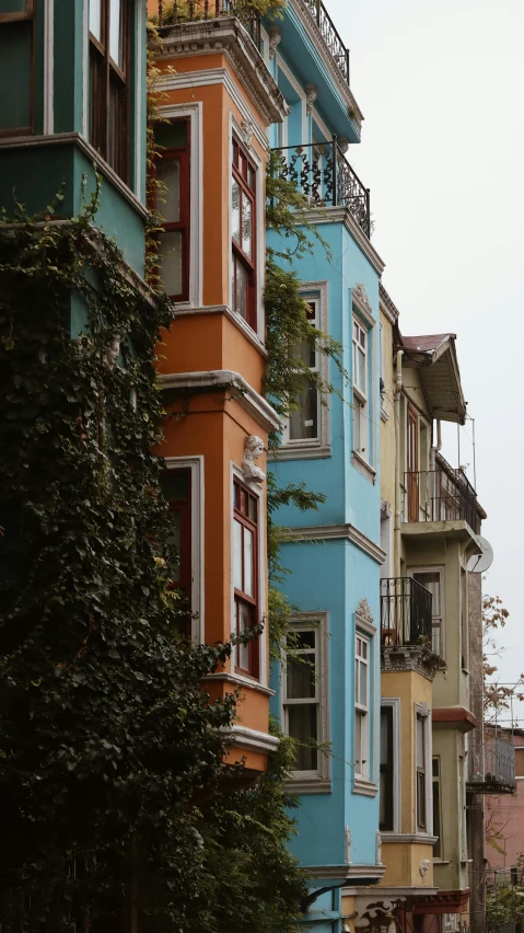 several multicolored buildings line the streets of an old town