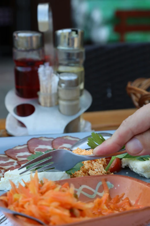 a person sits down for a snack and prepares to eat soing