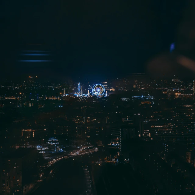 a view of the london eye and london eye building from atop the shard