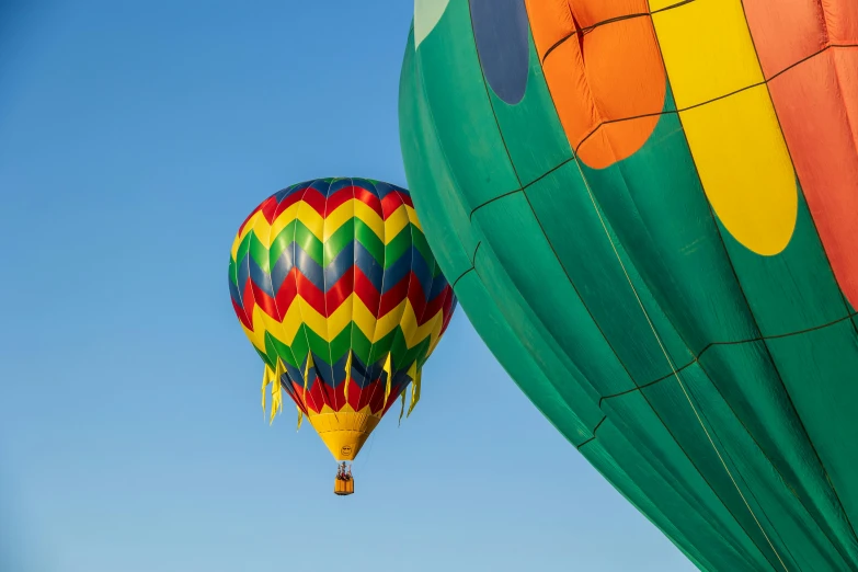 a colorful  air balloon with a blue sky in the background