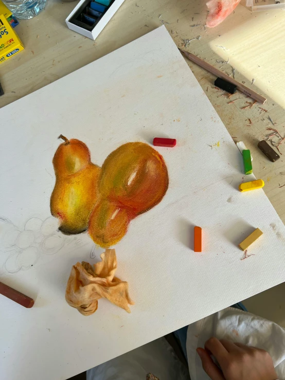 someone uses a knife to cut a small pomegranate