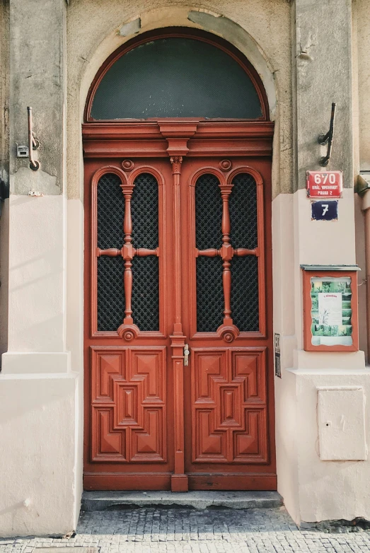 the front door to a building with two open doors