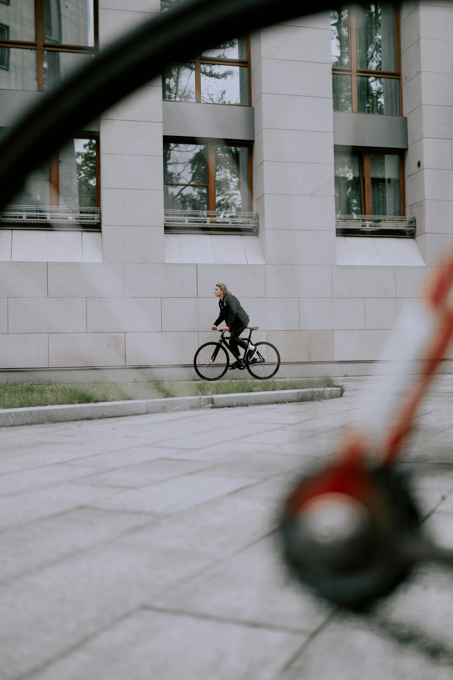 a man on his bike in the middle of an empty street
