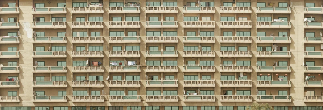 a multilevle building in china with green balconies