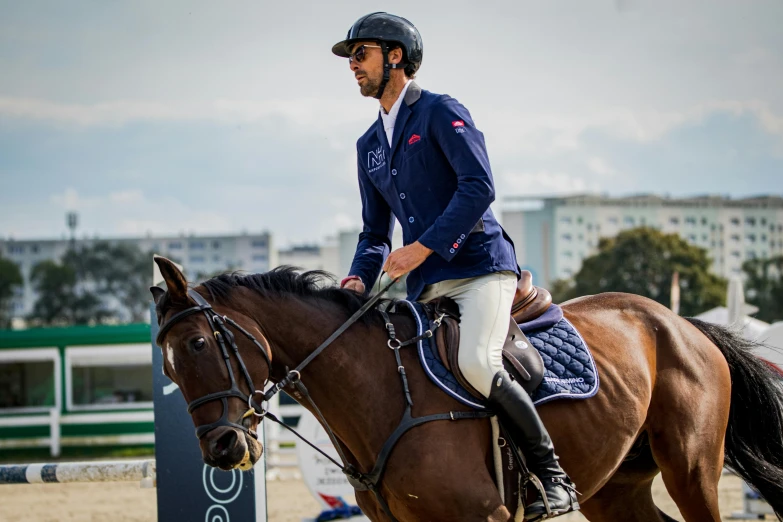 a man on a horse on the track