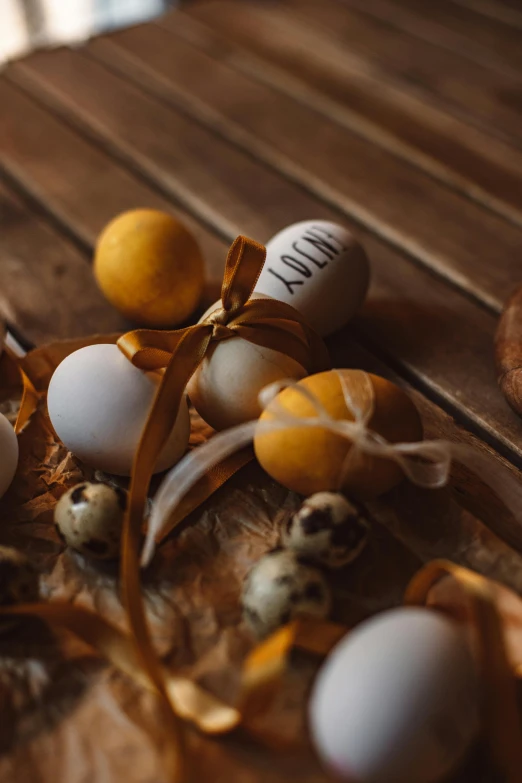 eggs in an egg dyer with ribbon and ribbons