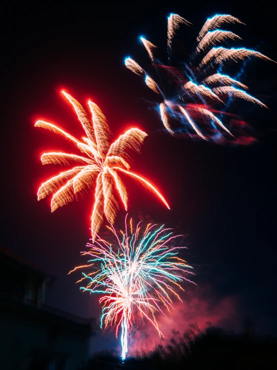 fireworks lit up the sky with red, blue and green