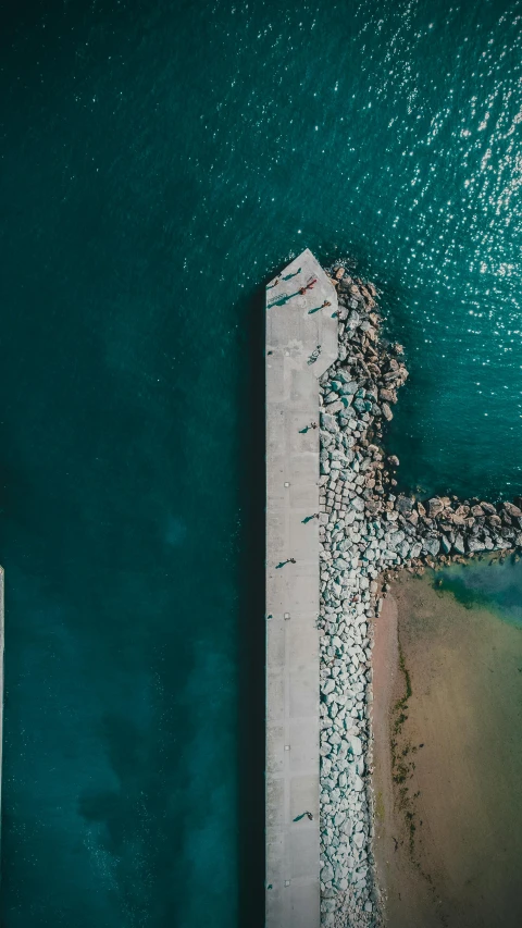 aerial view of pier in water and sky