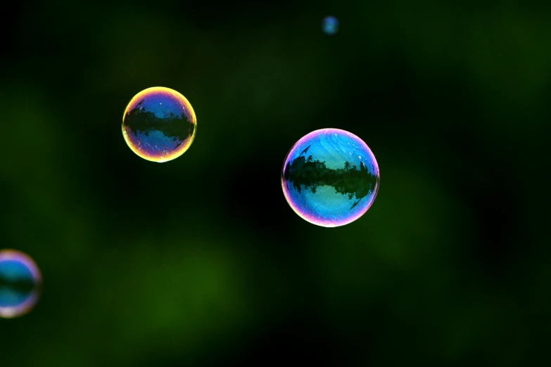 a picture of some water droplets on a green background