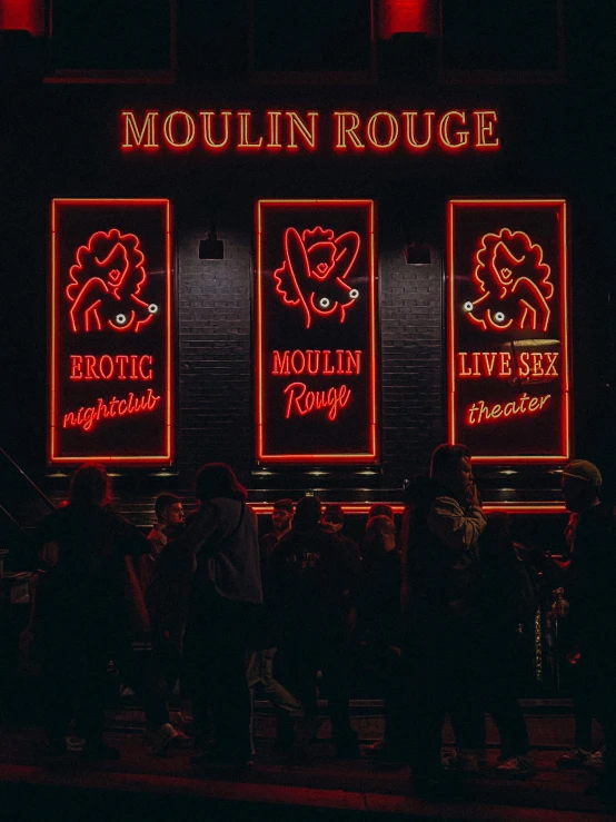 the words moulin roue are red and yellow