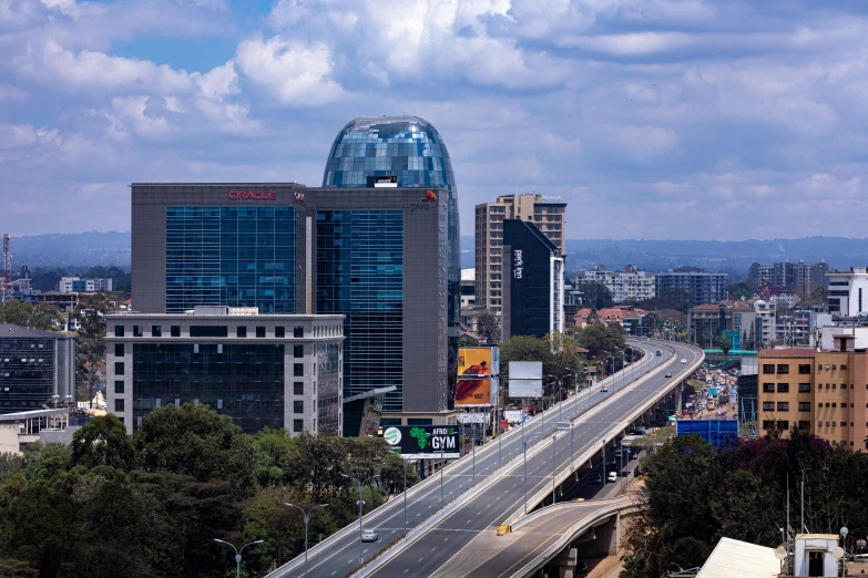 an overpass going through a city with tall buildings