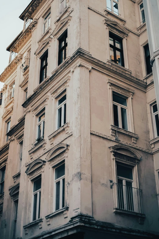 old apartment building with broken windows and no door