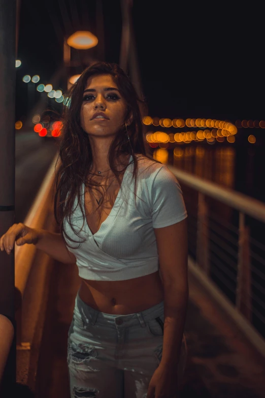 a woman is posing for the camera with lights