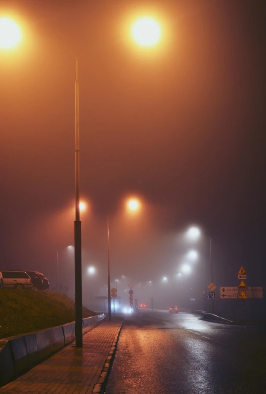 a street light that is on in the fog