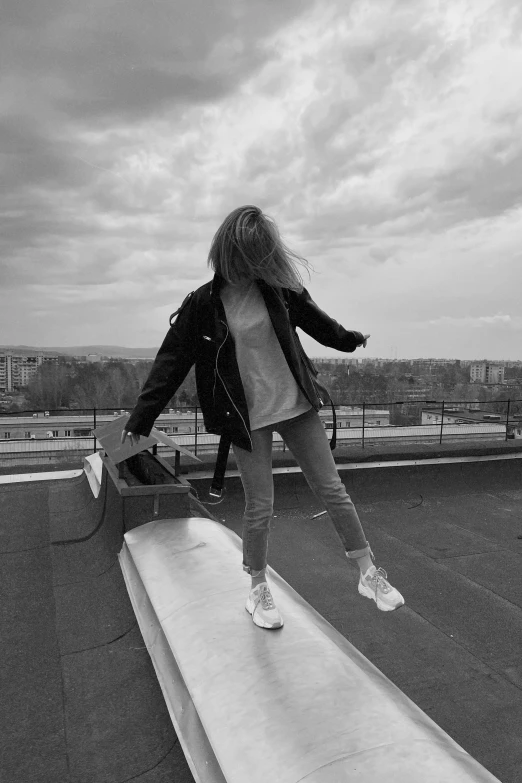 a girl in a white shirt is skating on a ramp