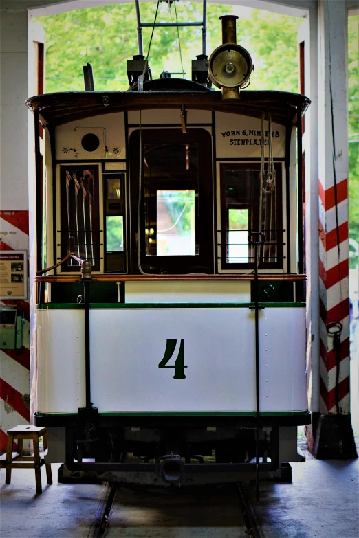 the front of a trolley car with windows and lights