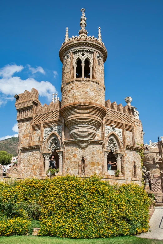 a beautiful castle like building sits on the side of the road