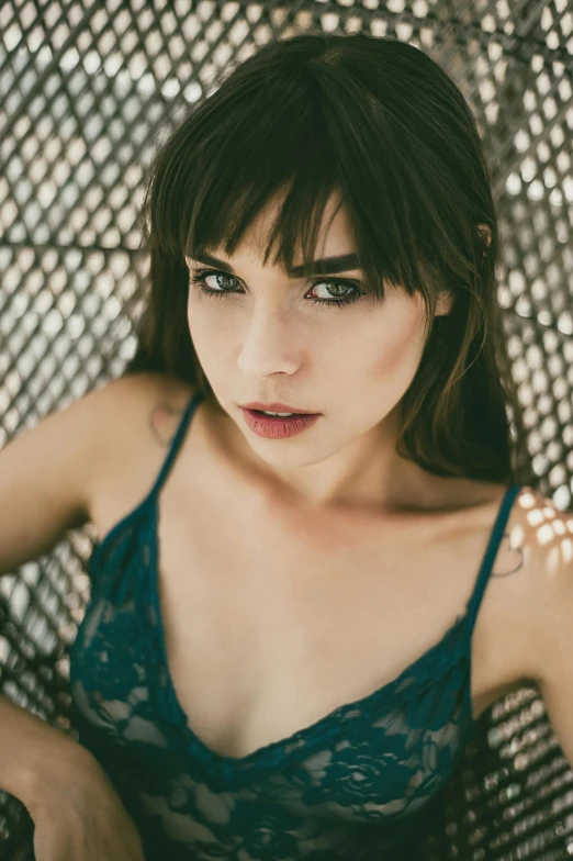 a young woman sitting in front of a screen wearing underwear