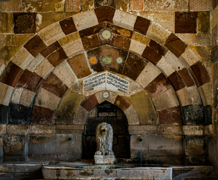 the interior of an abandoned building showing a decorative bricked arch