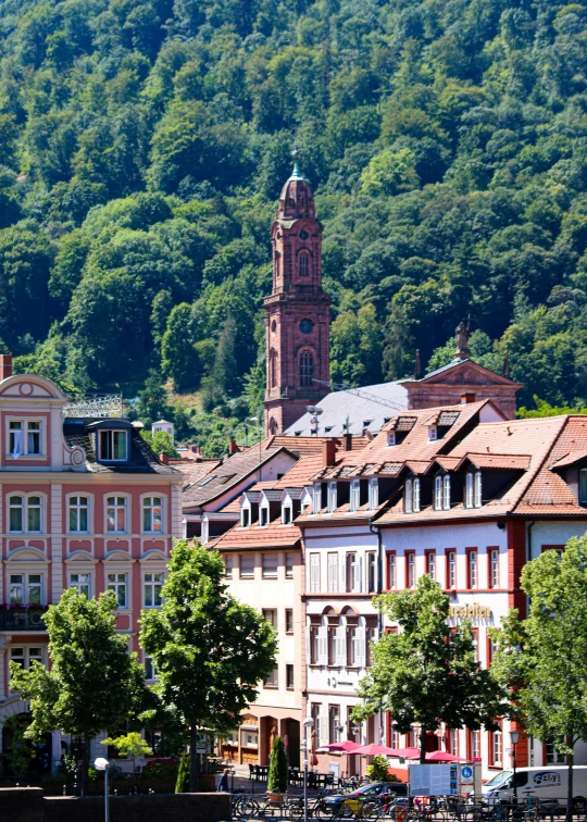 a view of many buildings near a steeple