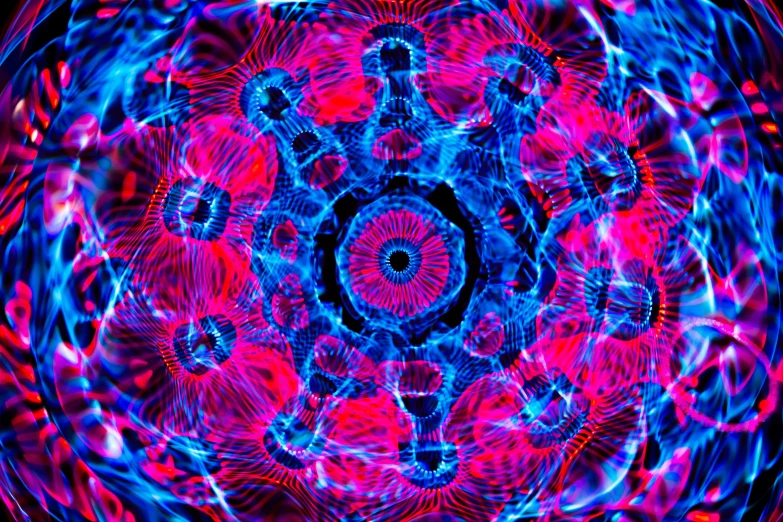a circular colorful design consisting of blue and red light effects