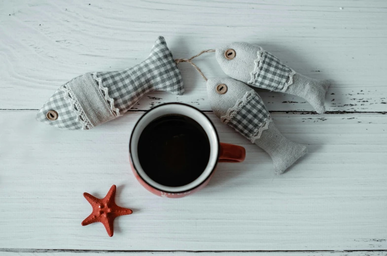 the starfish and the coffee are next to a cup