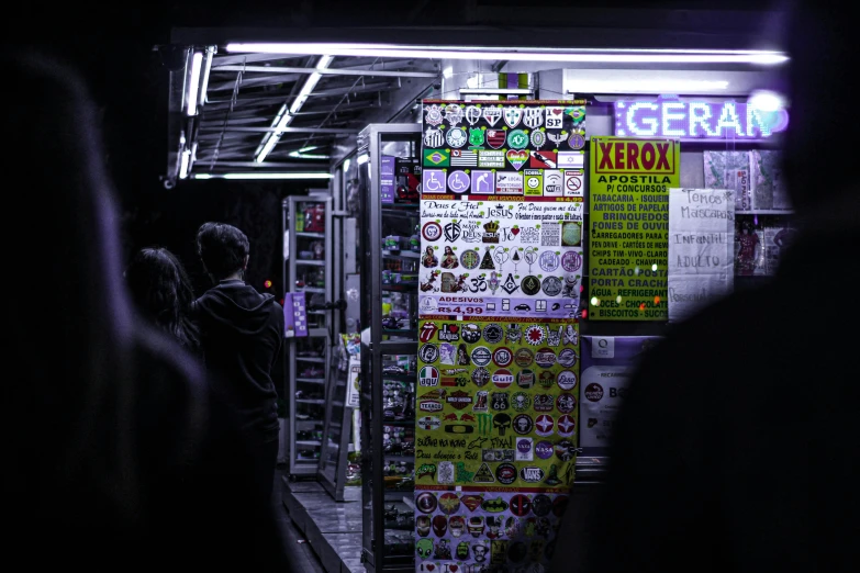 many magnets are attached to the side of a kiosk