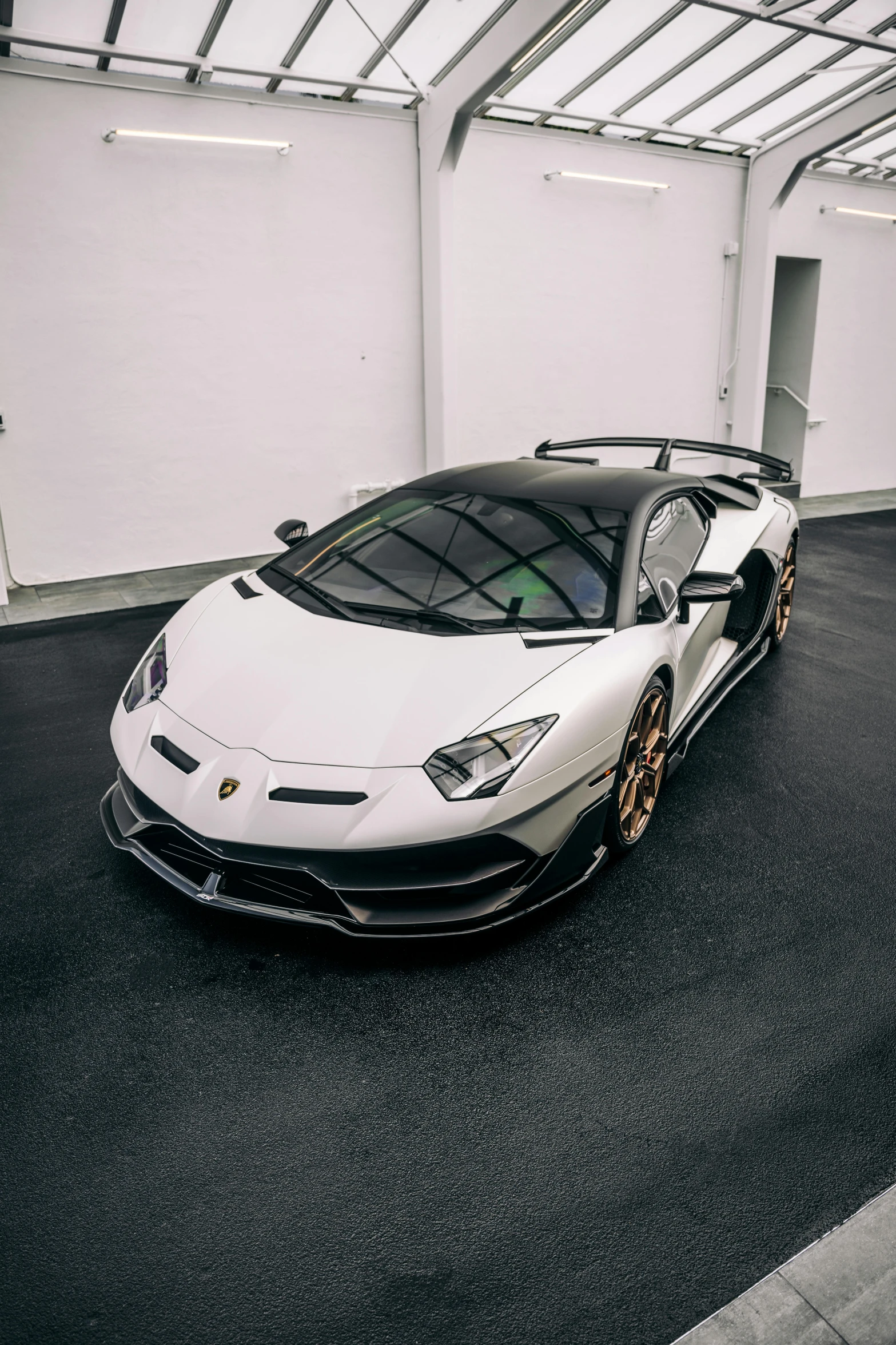 a very nice looking white sports car in a building