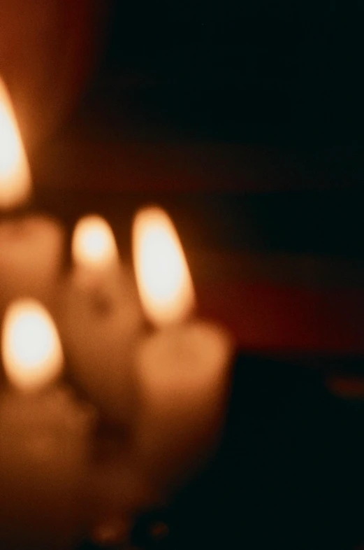 candles sitting on the table all lit up