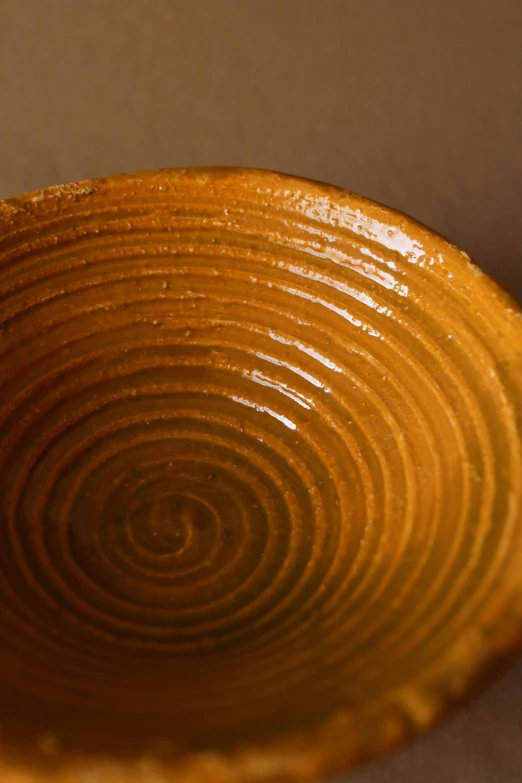 the orange colored bowl has been turned into an intricate pattern