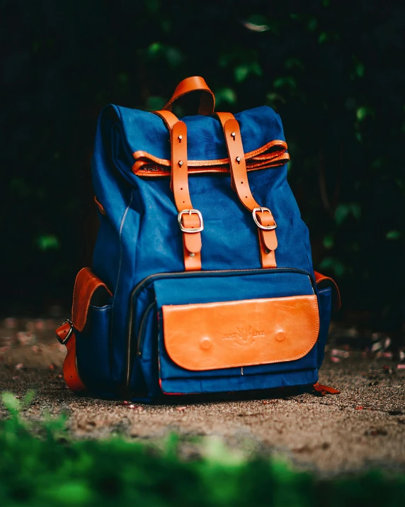 a backpack sitting in the shade with straps