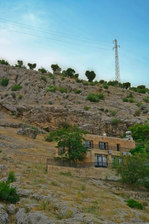 a po of an old building on the side of a hill